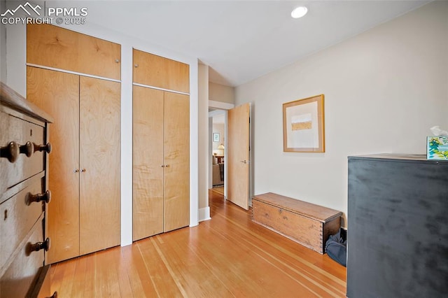 424 N Cedar St, Colorado Springs, CO 80903 - bedroom featuring two closets, light wood finished floors, and recessed lighting