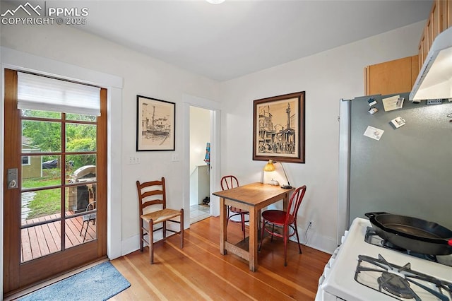424 N Cedar St, Colorado Springs, CO 80903 - dining room with light wood-style flooring and baseboards