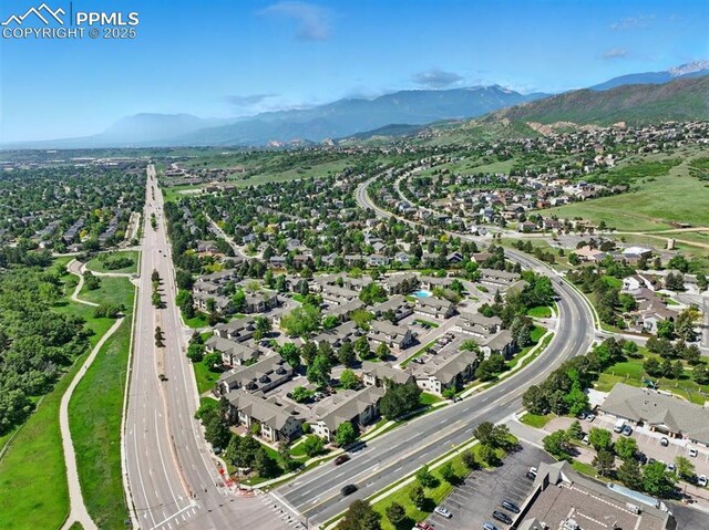 2150 Alicia Pt Unit 201, Colorado Springs, CO 80919 - aerial view of property and surrounding area with a major roadway, mountains, and nearby suburban area