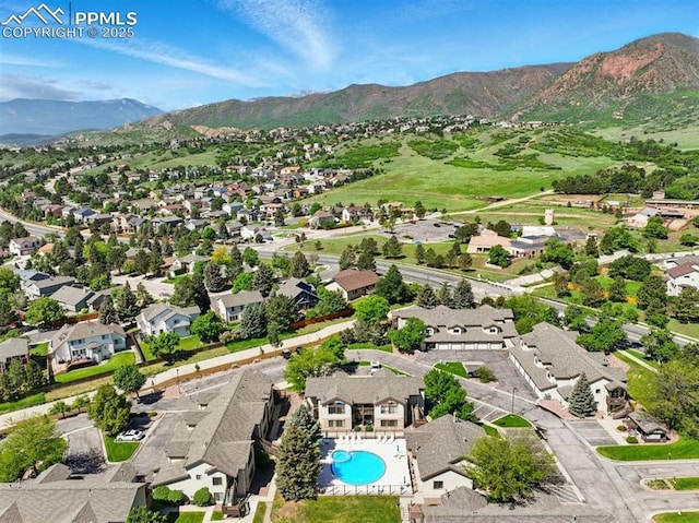 2150 Alicia Pt Unit 201, Colorado Springs, CO 80919 - aerial view of property and surrounding area with a mountainous background, nearby suburban area, and a pool area