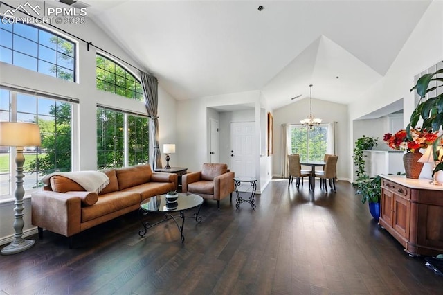 2150 Alicia Pt Unit 201, Colorado Springs, CO 80919 - living room featuring vaulted ceiling, a chandelier, dark wood-style floors, and baseboards