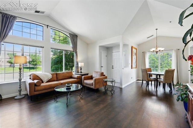 2150 Alicia Pt Unit 201, Colorado Springs, CO 80919 - living area featuring lofted ceiling, plenty of natural light, a chandelier, dark wood-style flooring, and baseboards