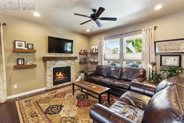 1593 Gold Hill Mesa Dr, Colorado Springs, CO 80905 - living room with wood finished floors, a ceiling fan, a stone fireplace, and recessed lighting