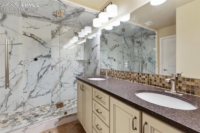 1593 Gold Hill Mesa Dr, Colorado Springs, CO 80905 - bathroom with a marble finish shower, double vanity, decorative backsplash, and tile walls