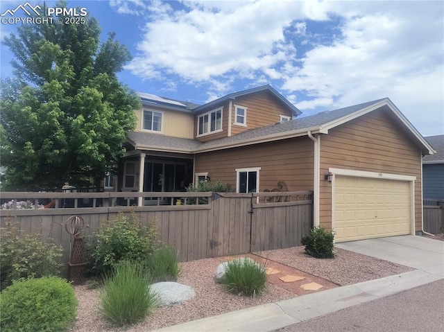 1593 Gold Hill Mesa Dr, Colorado Springs, CO 80905 - view of front of house with concrete driveway, a gate, a garage, and roof with shingles