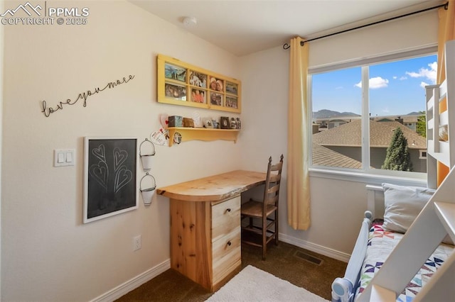 1593 Gold Hill Mesa Dr, Colorado Springs, CO 80905 - office area featuring dark colored carpet and built in study area