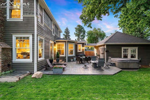 3 Mesa Ln, Colorado Springs, CO 80906 - rear view of house featuring a hot tub, a patio, and a yard