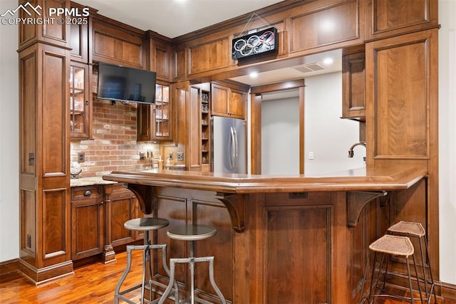 3 Mesa Ln, Colorado Springs, CO 80906 - indoor wet bar with freestanding refrigerator and light wood-type flooring