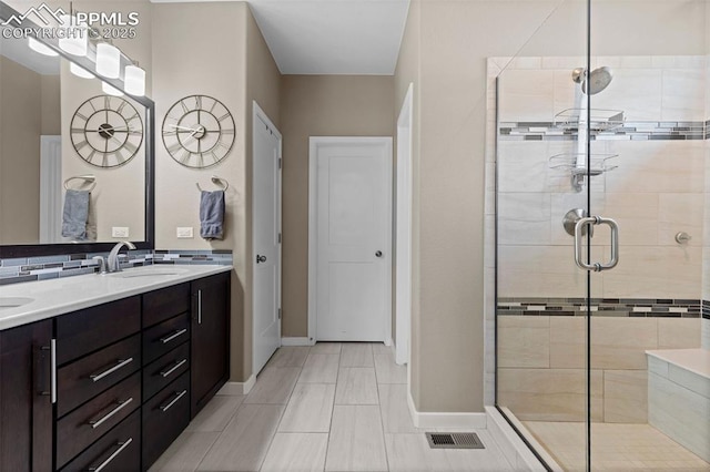 1734 Summerglow Ln, Monument, CO 80132 - full bathroom with a shower stall, double vanity, and baseboards