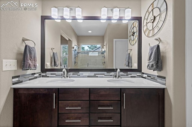 1734 Summerglow Ln, Monument, CO 80132 - bathroom with double vanity, a shower stall, and tasteful backsplash