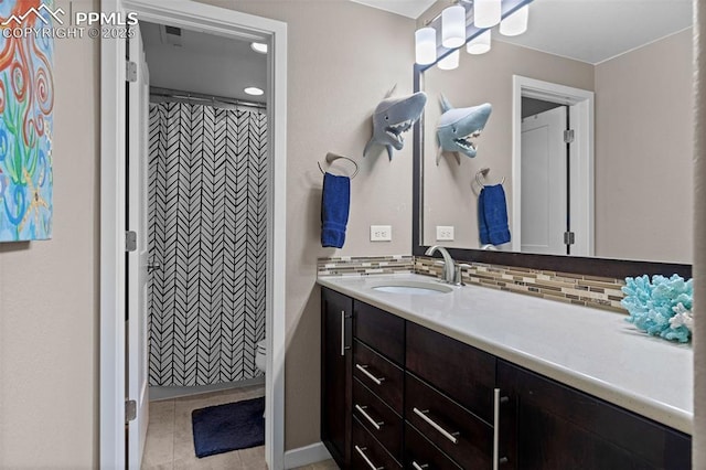 1734 Summerglow Ln, Monument, CO 80132 - full bathroom with vanity, backsplash, tile patterned floors, and curtained shower