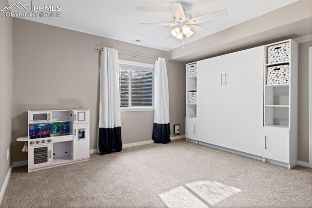 1734 Summerglow Ln, Monument, CO 80132 - unfurnished bedroom with carpet floors, baseboards, and a ceiling fan