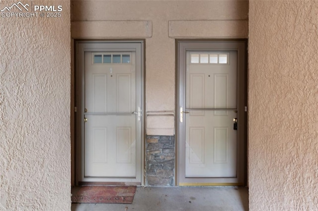 3867 Josephine Hts, Colorado Springs, CO 80906 - property entrance featuring stucco siding and stone siding