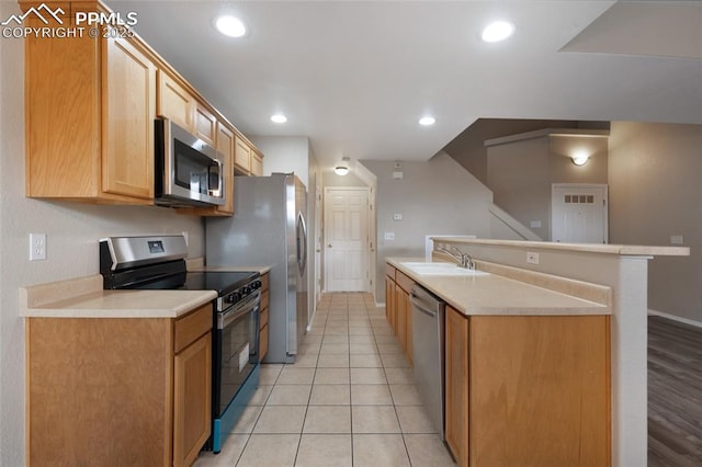 3867 Josephine Hts, Colorado Springs, CO 80906 - kitchen featuring appliances with stainless steel finishes, light countertops, recessed lighting, and light tile patterned floors