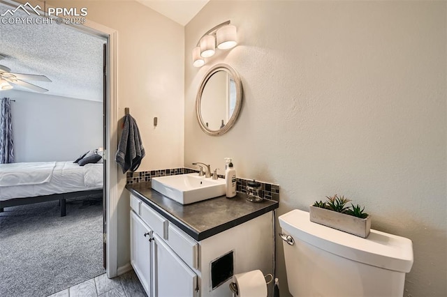 4652 Excalibur Ct, Colorado Springs, CO 80917 - half bath featuring vanity, connected bathroom, and a ceiling fan