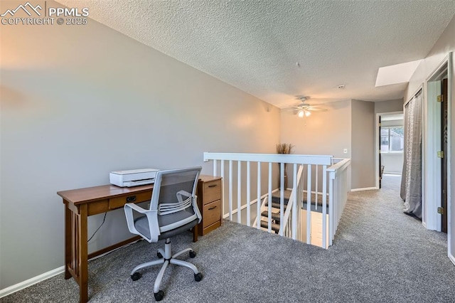 4652 Excalibur Ct, Colorado Springs, CO 80917 - carpeted home office with a textured ceiling and ceiling fan