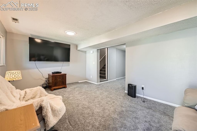 4652 Excalibur Ct, Colorado Springs, CO 80917 - carpeted living area with a textured ceiling and stairway