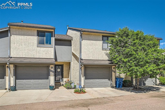 4652 Excalibur Ct, Colorado Springs, CO 80917 - multi unit property with stucco siding, a garage, and concrete driveway