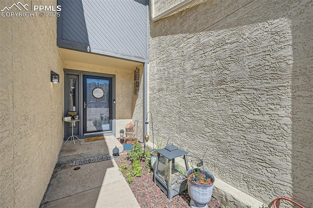 4652 Excalibur Ct, Colorado Springs, CO 80917 - doorway to property with stucco siding