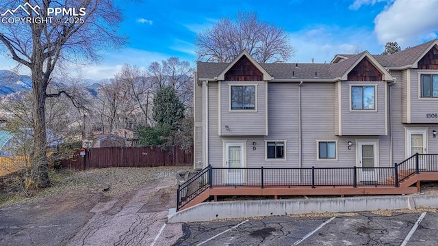 1506 Crestone Ave Unit D, Colorado Springs, CO 80905 - rear view of house with a deck and uncovered parking