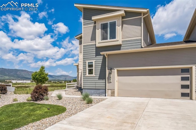 1842 Peak Prairie Ln, Monument, CO 80132 - view of property exterior with a mountain view, driveway, and a garage