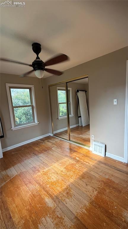 5030 Beach Ct, Denver, CO 80221 - empty room featuring wood-type flooring, baseboards, and plenty of natural light