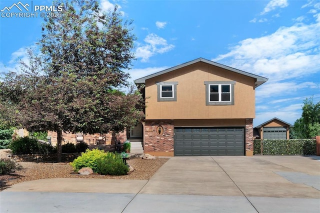 3512 Chico Cir, Colorado Springs, CO 80918 - view of front of property with a garage, driveway, and brick siding