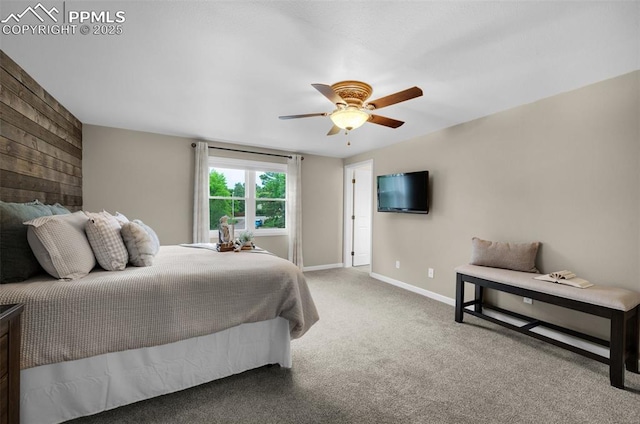 3512 Chico Cir, Colorado Springs, CO 80918 - carpeted bedroom featuring wood walls and a ceiling fan