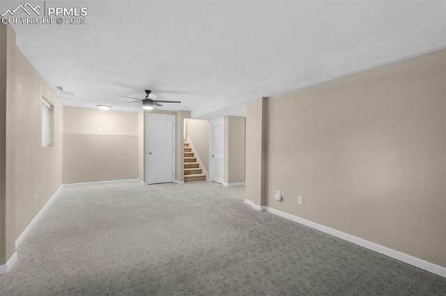 3512 Chico Cir, Colorado Springs, CO 80918 - spare room with stairway, a ceiling fan, and carpet