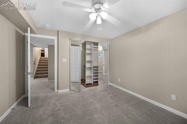 3512 Chico Cir, Colorado Springs, CO 80918 - unfurnished bedroom featuring carpet, a textured ceiling, a closet, and a ceiling fan