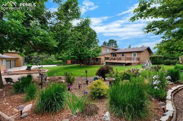 3512 Chico Cir, Colorado Springs, CO 80918 - view of green lawn with a deck