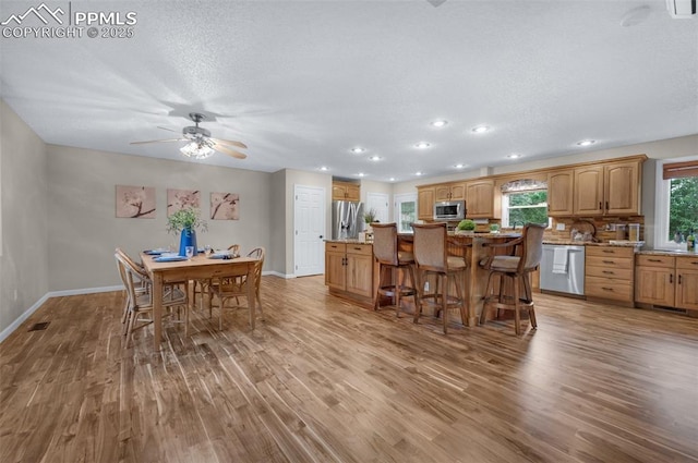 3512 Chico Cir, Colorado Springs, CO 80918 - dining space featuring wood finished floors, recessed lighting, a ceiling fan, and a textured ceiling