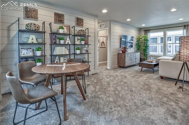 7703 Lost Trail Dr, Colorado Springs, CO 80908 - dining area featuring carpet flooring, recessed lighting, and wood walls