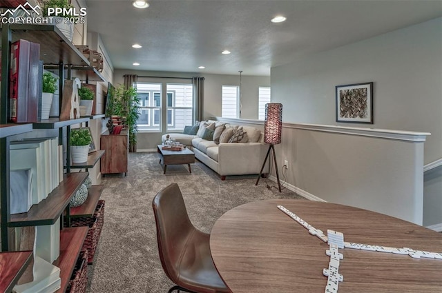 7703 Lost Trail Dr, Colorado Springs, CO 80908 - living room featuring baseboards, recessed lighting, and carpet