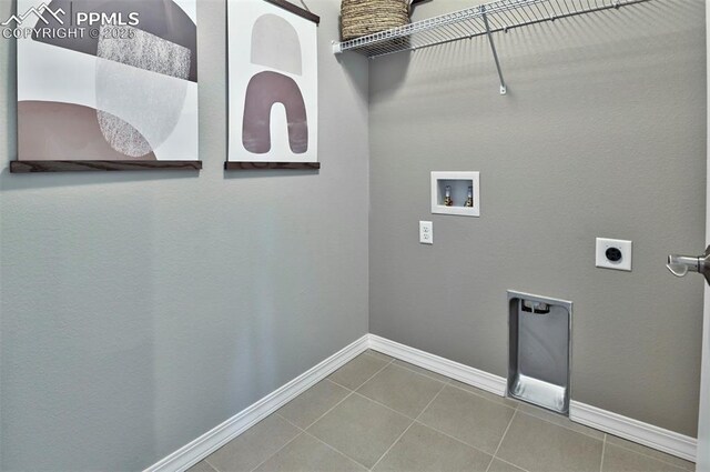 7703 Lost Trail Dr, Colorado Springs, CO 80908 - laundry area featuring electric dryer hookup, hookup for a washing machine, tile patterned flooring, and baseboards