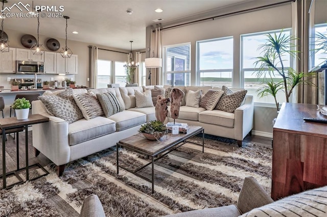 7703 Lost Trail Dr, Colorado Springs, CO 80908 - living area featuring a chandelier, wood finished floors, recessed lighting, and baseboards