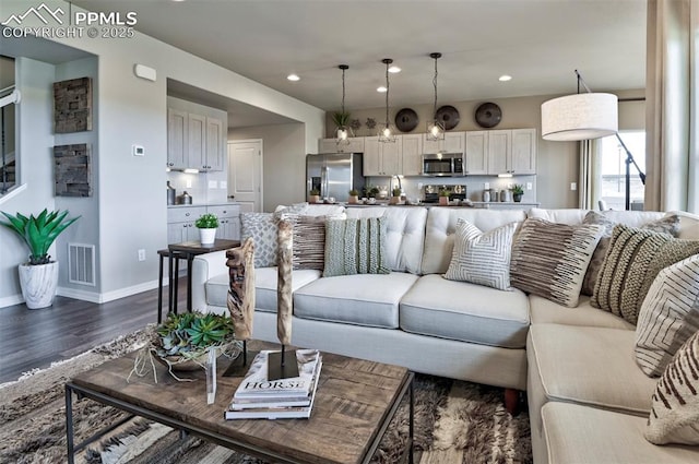 7703 Lost Trail Dr, Colorado Springs, CO 80908 - living area featuring dark wood-style flooring, recessed lighting, and baseboards