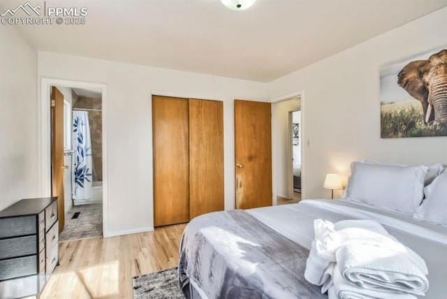3622 Anemone Cir, Colorado Springs, CO 80918 - bedroom with light wood finished floors, ensuite bath, a closet, and baseboards