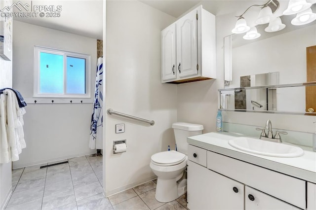 3622 Anemone Cir, Colorado Springs, CO 80918 - bathroom featuring vanity, toilet, a shower with curtain, baseboards, and tile patterned flooring
