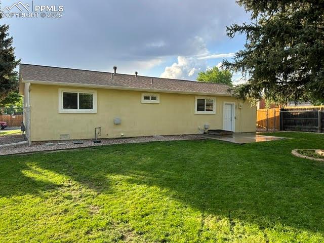 4425 Barkman Cir, Colorado Springs, CO 80916 - back of house with stucco siding