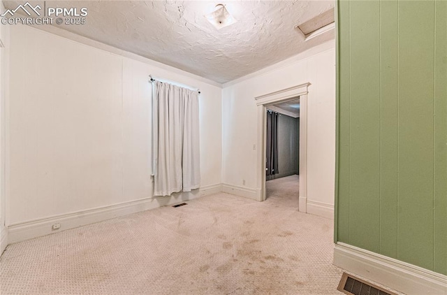 2830 W Kiowa St, Colorado Springs, CO 80904 - carpeted spare room featuring attic access and a textured ceiling