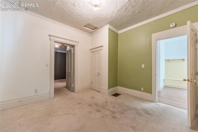 2830 W Kiowa St, Colorado Springs, CO 80904 - carpeted empty room with a textured ceiling and baseboards