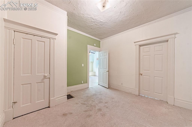 2830 W Kiowa St, Colorado Springs, CO 80904 - unfurnished bedroom with carpet, ornamental molding, and a textured ceiling