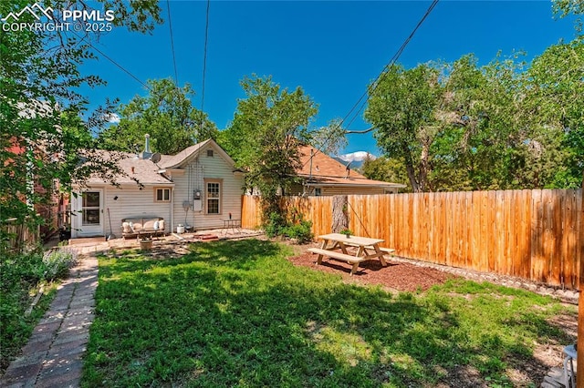 2830 W Kiowa St, Colorado Springs, CO 80904 - fenced backyard with a patio area