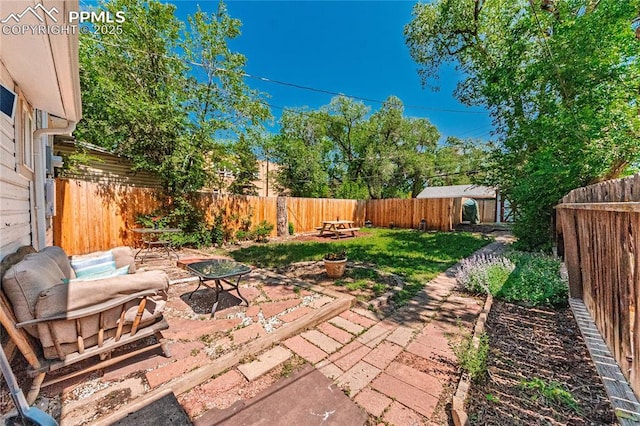 2830 W Kiowa St, Colorado Springs, CO 80904 - fenced backyard featuring a patio area, an outdoor fire pit, and an outdoor structure