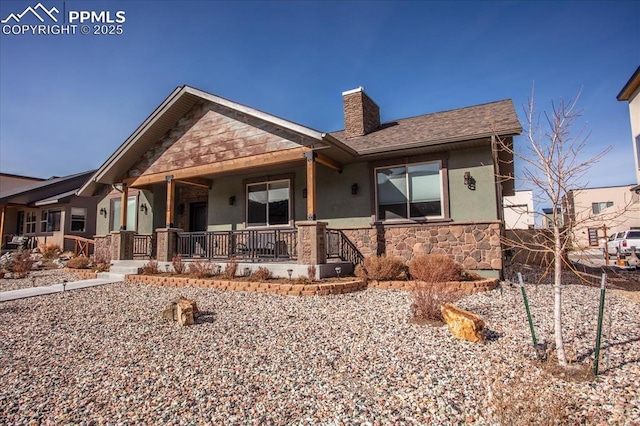 1124 E Poncha Ave, Salida, CO 81201 - view of front of house featuring covered porch, stucco siding, stone siding, and a chimney