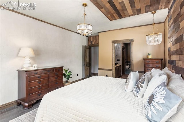 1124 E Poncha Ave, Salida, CO 81201 - bedroom featuring a chandelier, wood finished floors, and crown molding