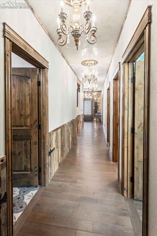 1124 E Poncha Ave, Salida, CO 81201 - hall with a chandelier and hardwood / wood-style floors