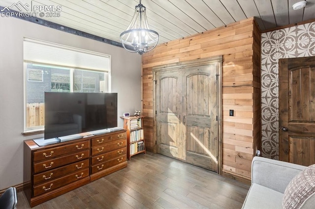 1124 E Poncha Ave, Salida, CO 81201 - living area featuring wood walls, dark wood finished floors, a chandelier, and wooden ceiling