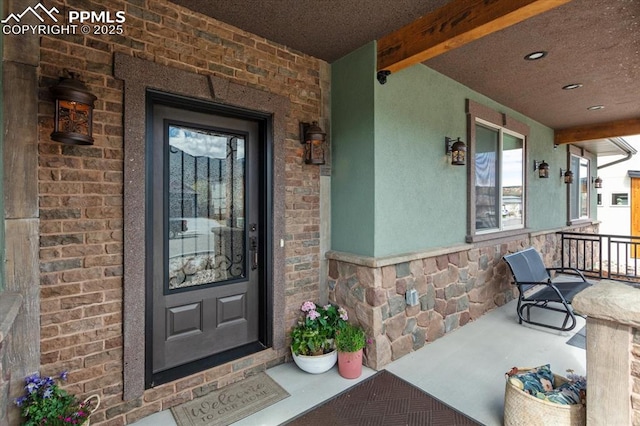 1124 E Poncha Ave, Salida, CO 81201 - doorway to property with covered porch, brick siding, and stone siding
